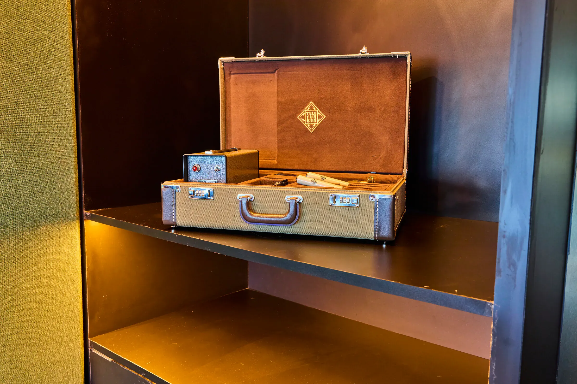 Telefunken ELA M 260 stereo microphone kit in its case, on the shelf in the Verdant Sound control room